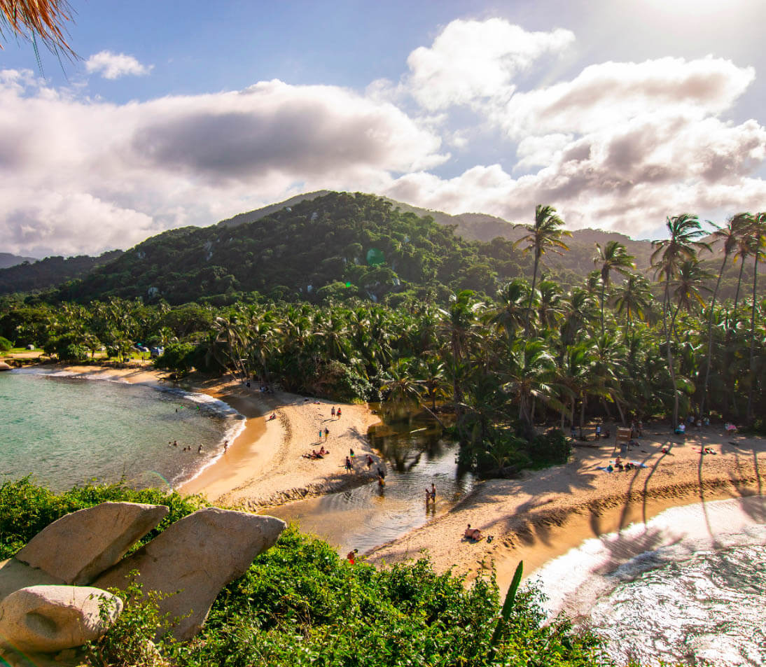 Stunning double bay of Cabo San Juan in Tayrona Park, with golden sand beaches, turquoise waters, and lush green mountains