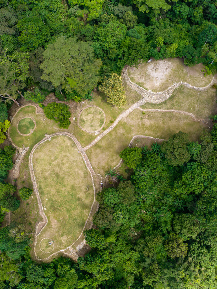 Drone aerial view of circular terraces and pathway network at Bunkuany archaeological site, Sierra Nevada de Santa Marta
