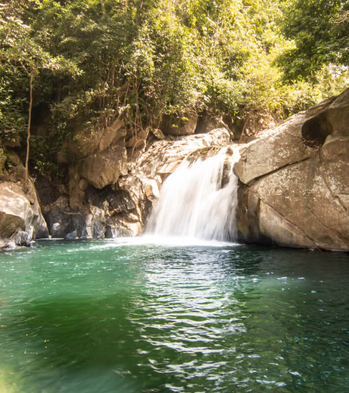 Beautiful waterfall and natural pool in Wiwa indigenous territory of Gotsezhy, Sierra Nevada de Santa Marta, Colombia